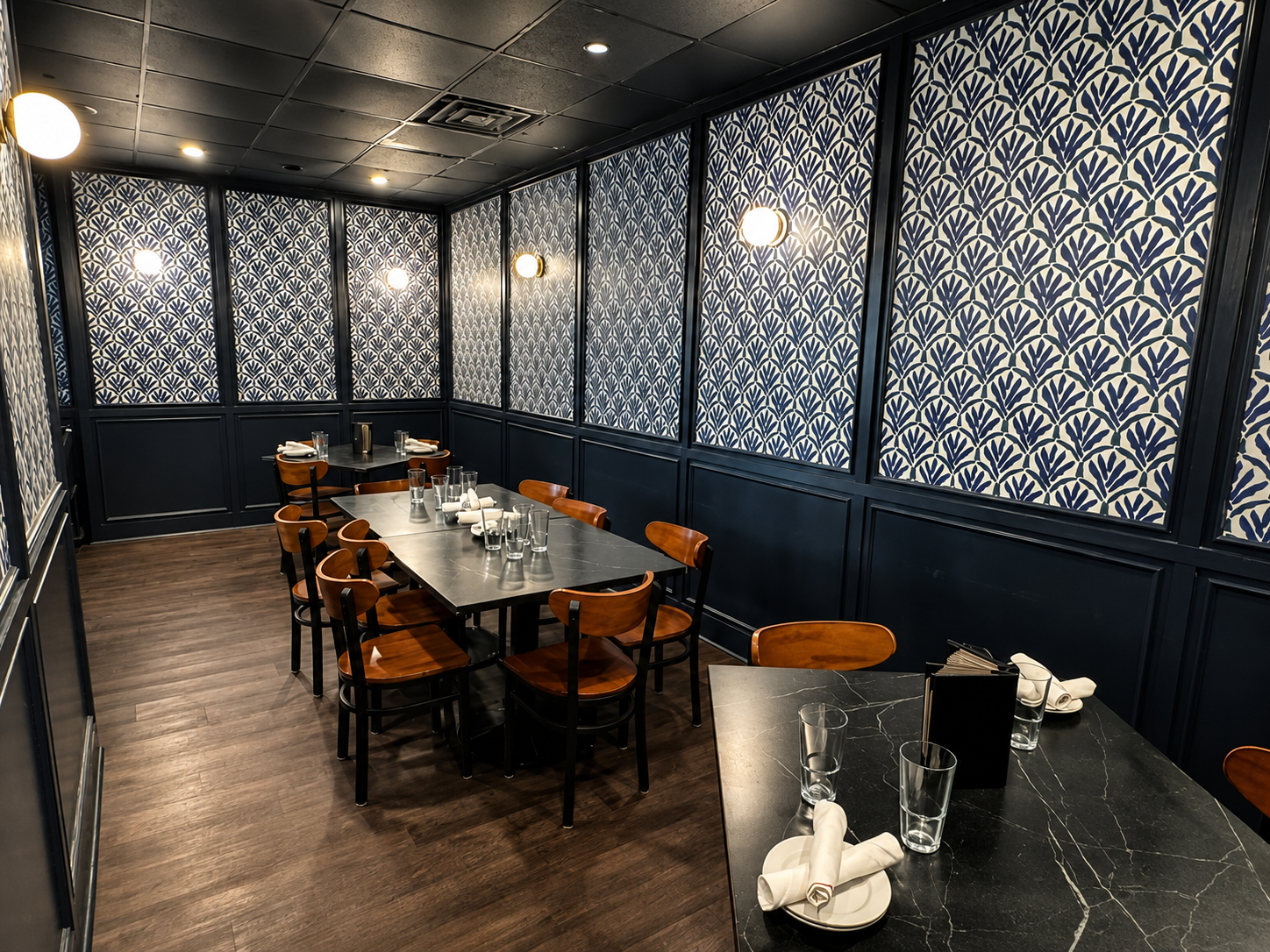 POUR's private dining room with blue patterned wallpaper